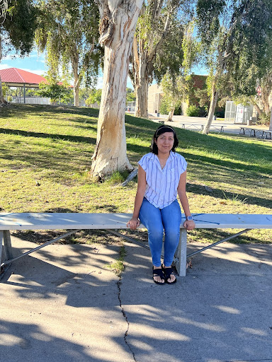 Senior Leilany Diaz-Rivas poses for a picture on a bench
