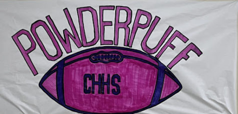 A banner in the hallway to promote the powderpuff game.