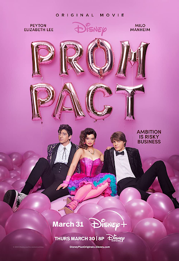 A man in a black suit, a woman in a bright pink dress, and another man in a black suit sitting on the ground covered in pink balloons. The words “Prom Pact” are spelled out in letter balloons above their heads.