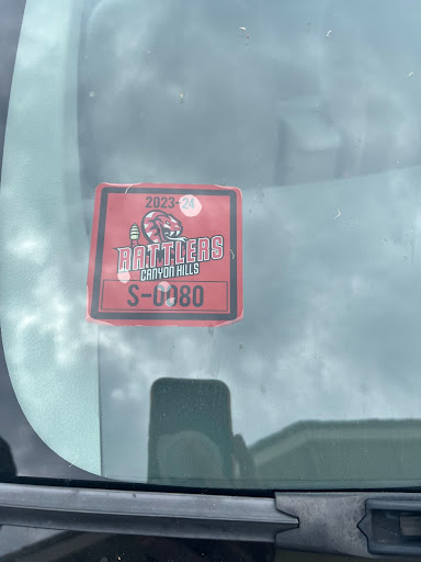 Students must position their parking stickers on the front windshield on the passenger side, just right above the dashboard.