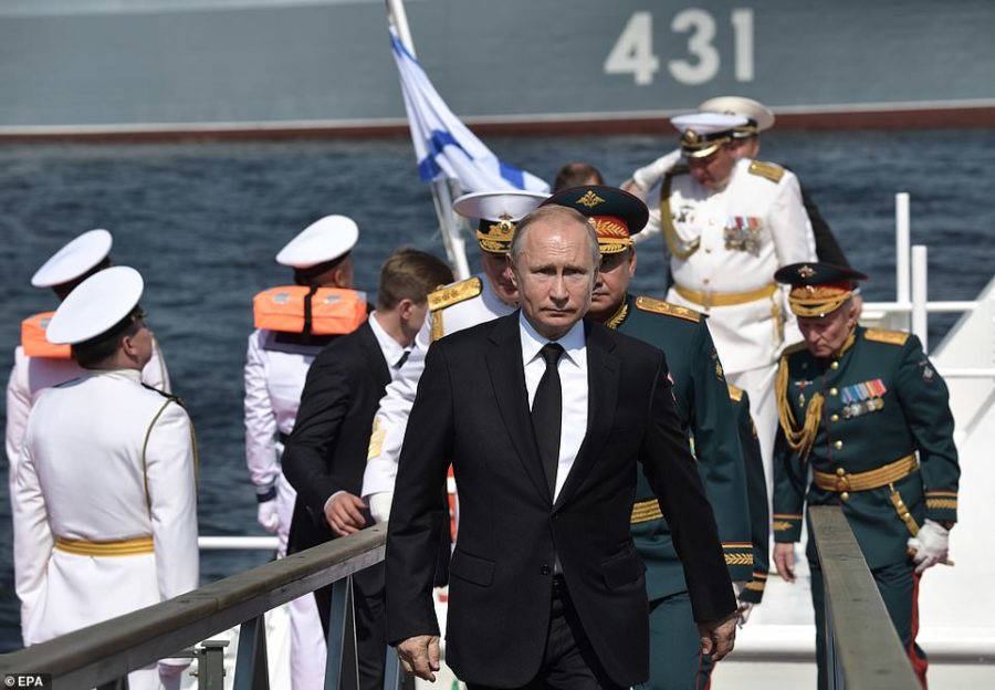 Vladimir Putin with russian military on warship