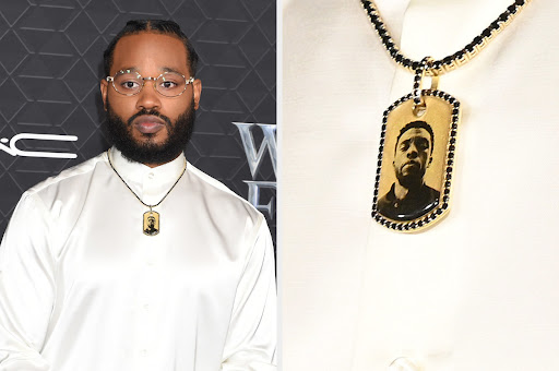 Director Ryan Coogler paying tribute to Chadwick Boseman with personalized necklace at the Black Panther: Wakanda Forever red carpet