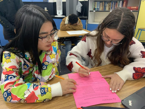 students reviewing school behavior contracts