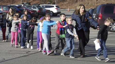 Children being led out by police and teachers after the Sandyhook Elementary School Shooting on December 14, 2012. 