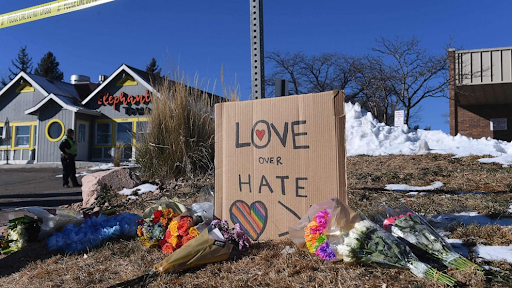 tributes to victims amassed after a shooting in colorado