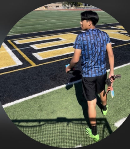 student prepares to play soccer