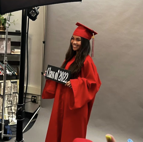 posing for cap and gown shoot