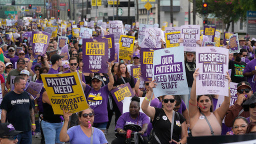 Thousands of healthcare workers protesting in the streets of Los Angeles.
