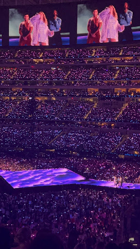 Fans in the stadium roaring along with Taylor Swift during the duration of her show 
