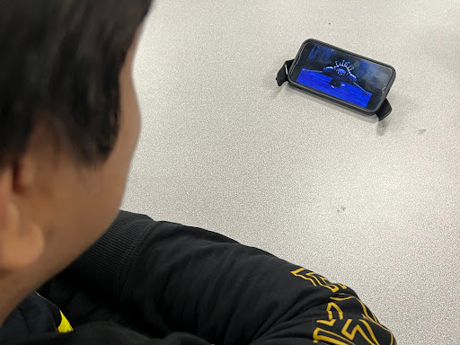 Senior Joshua Arreola watches Kung Fu Panda on his phone, which features widely regarded character Tai Lung, who is praised by both critics and audiences for his well written characterization and motivation (Ben Ruiz-Rodriguez)