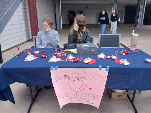 Two CHHS students spread the love at school, offering “Valentines Grams” for students to send to the classroom their special someone (Casper Petruzzelli)